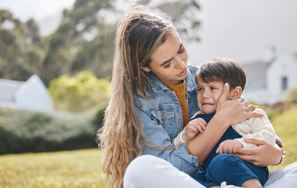 A mother with her child crying at kindy dropoff