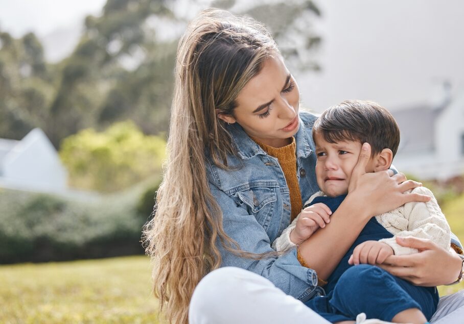 A mother with her child crying at kindy dropoff
