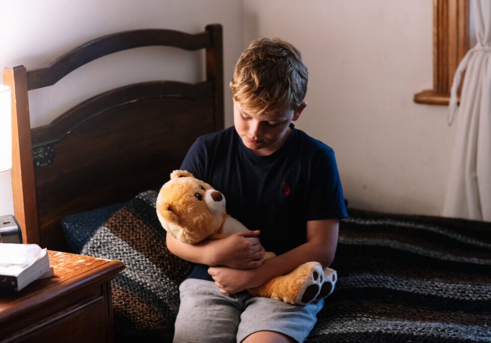 Child with emotional support bear